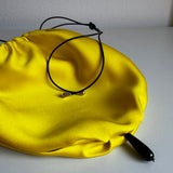 Yellow silk bag with onyx