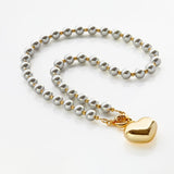 Golden heart grey pearls