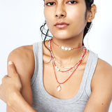 Red beaded necklace with crystal pendant