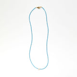 Blue beaded necklace with pearl
