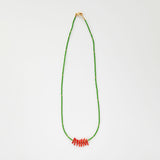 Green beaded necklace with coral