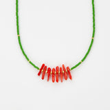 Green beaded necklace with coral