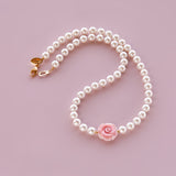 In Bloom pink shell rose white pearls