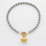Golden heart dark grey pearls