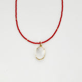 Red beaded necklace with crystal pendant