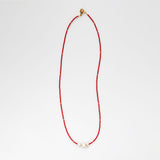 Red beaded necklace with 3 pearls